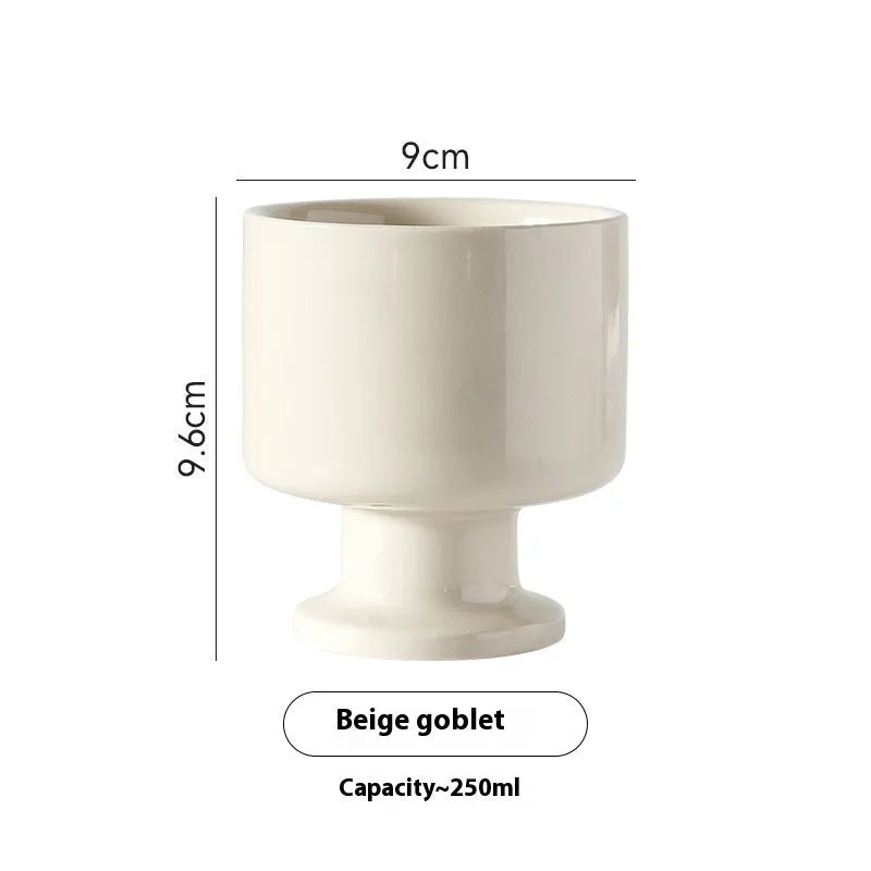 Hand-pinched irregular ceramic mug in solid colour with modern design and 14.5cm height