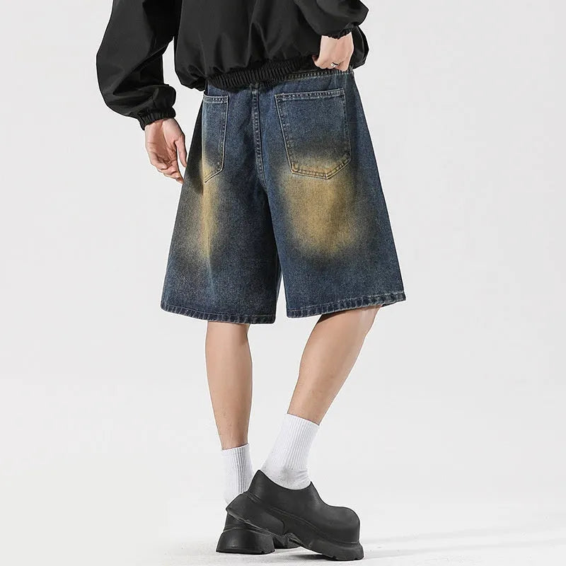 Men's distressed loose fit jeans in retro blue cotton denim with ripped detailing