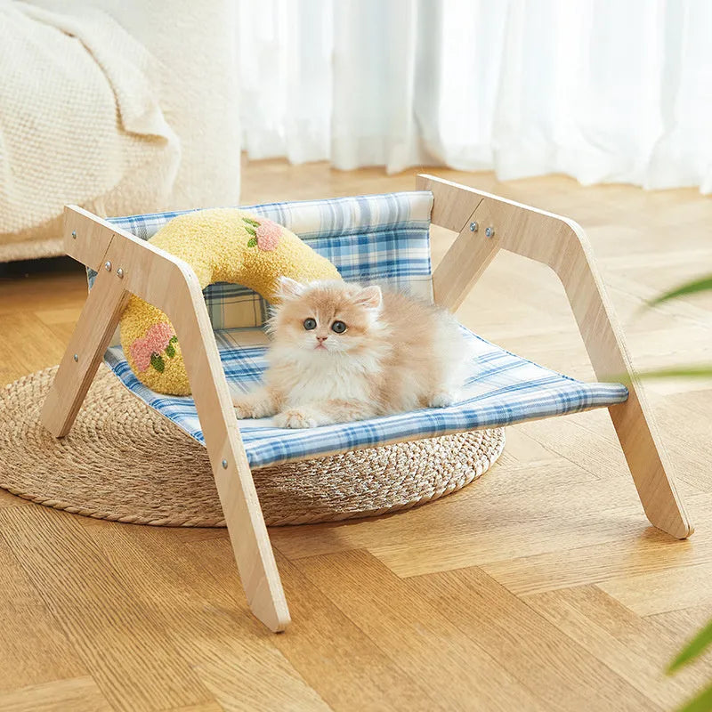 Wooden elevated cat bed with beach chair design and soft cloth hammock in blue colour
