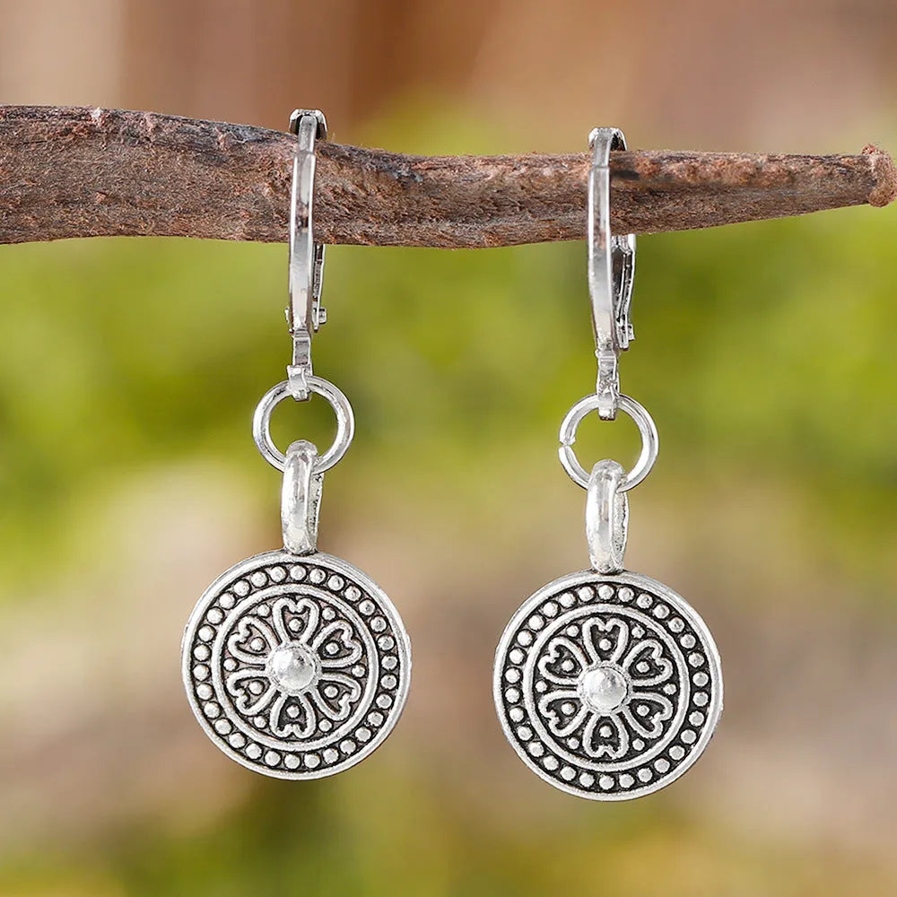 Bohemian style geometric earrings with distressed round print ethnic designs