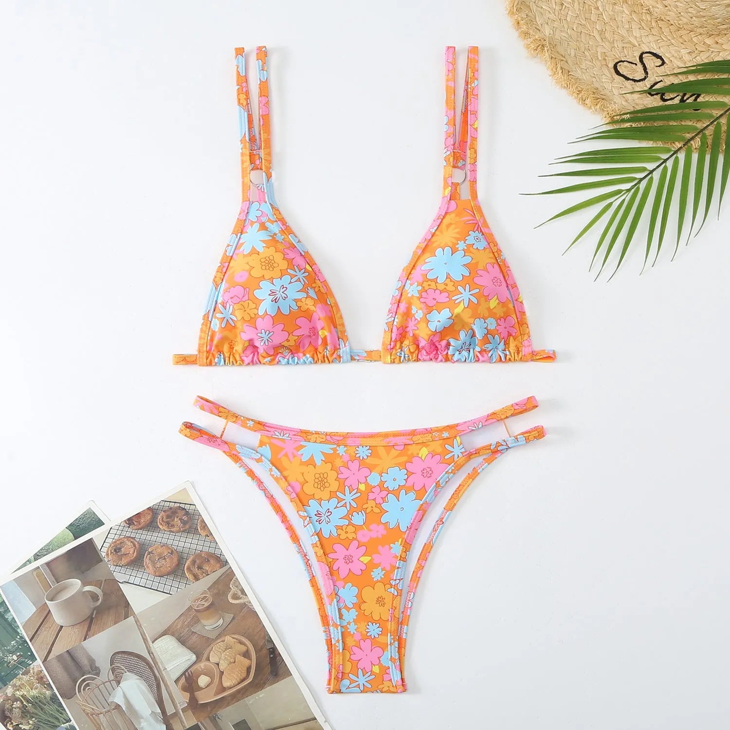 Women's halterneck bikini set in a floral print, showing the two-piece briefs swimwear in a choice of colours.