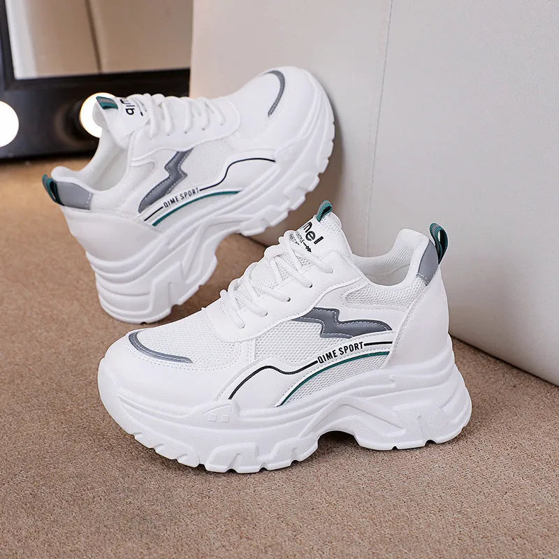 Women's white beige height increasing dad shoes with mesh upper and cross straps.