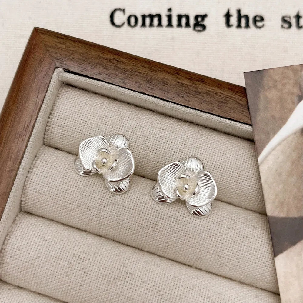 Retro style flower earrings with petal detailing in gold or silver electroplated finish on copper