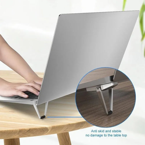 Silver aluminium folding laptop bracket showing compact 4.8cm x 3.5cm dimensions with adhesive backing