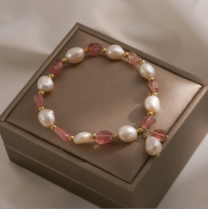 Handcrafted strawberry quartz crystal bracelet with Hetian jade peach blossom charms