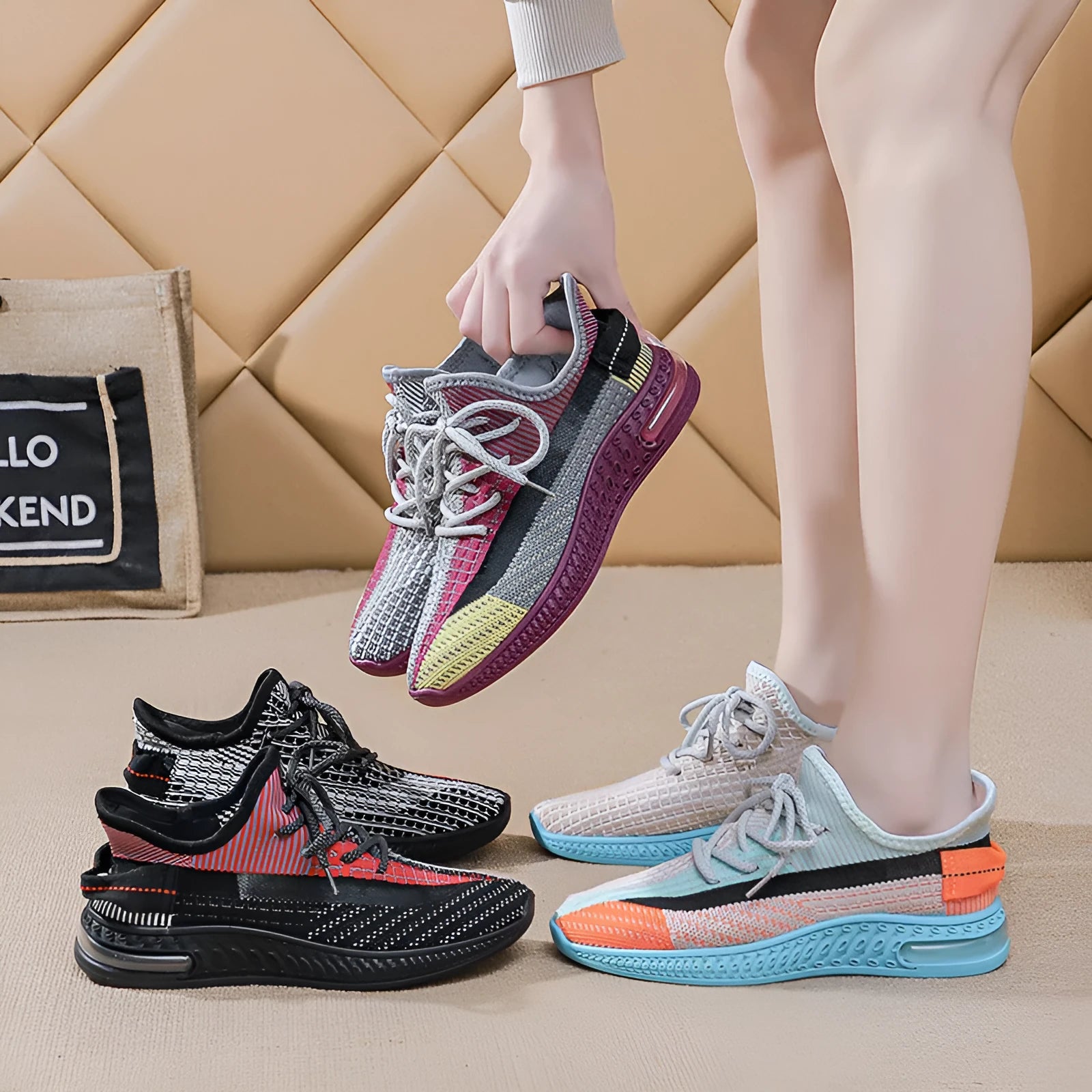 Women's casual running shoes in purple, black and orange colours with round toe and lace-up design