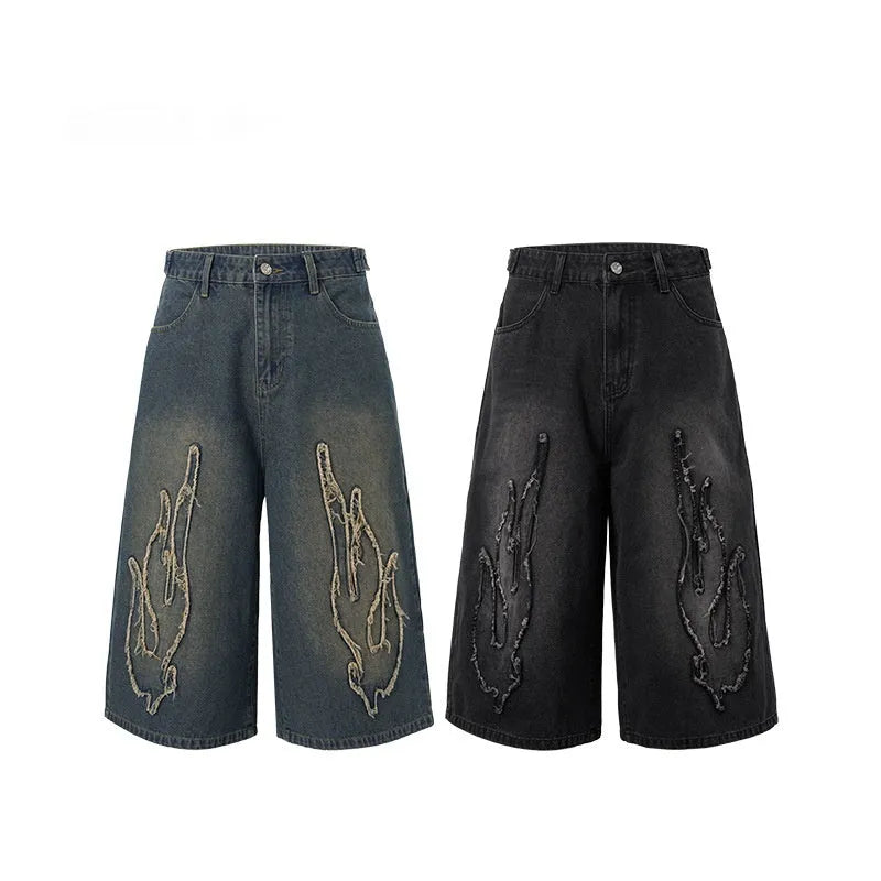 Men's black denim shorts with cropped patch flame embroidery design and straight-leg fit