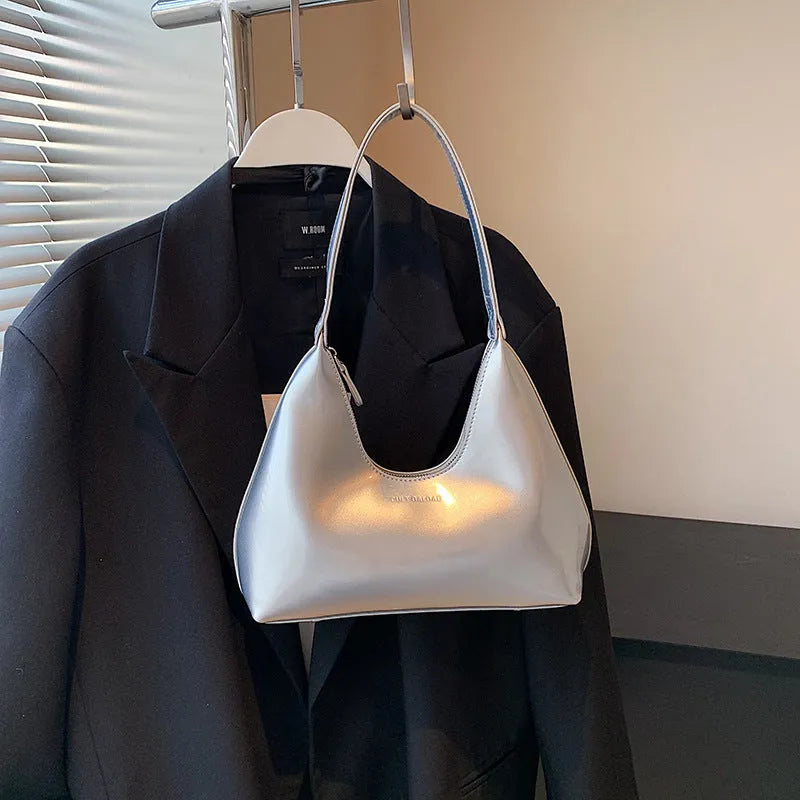 French style PU leather shoulder bag with sewing line detail and dumpling shape, available in multiple colours