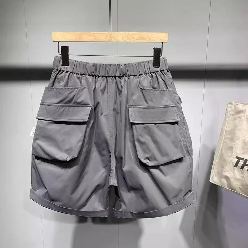 Men's large size work shorts with pockets in black or grey colours