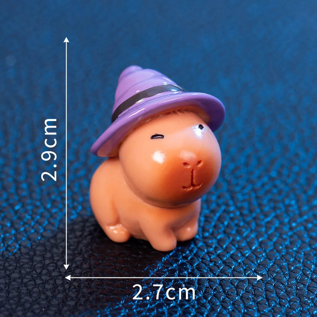 Halloween capybara resin figurine in one of eight designs like pumpkin or vampire.