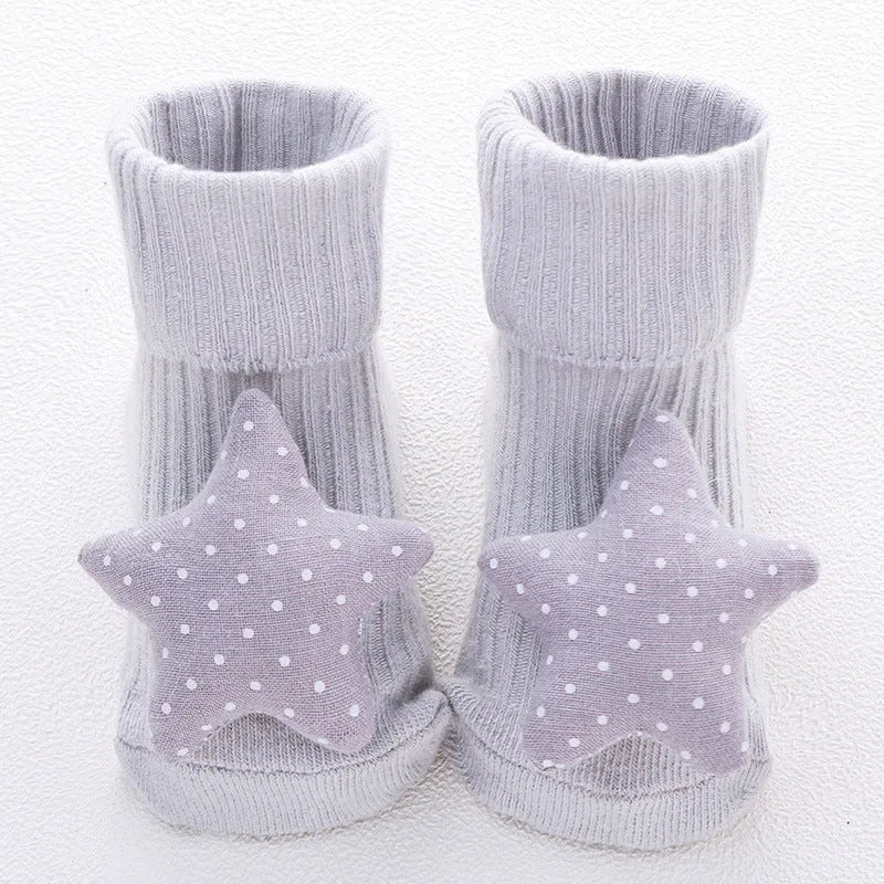 Cotton baby floor socks in various colours and patterns including bows, stars, and animal designs