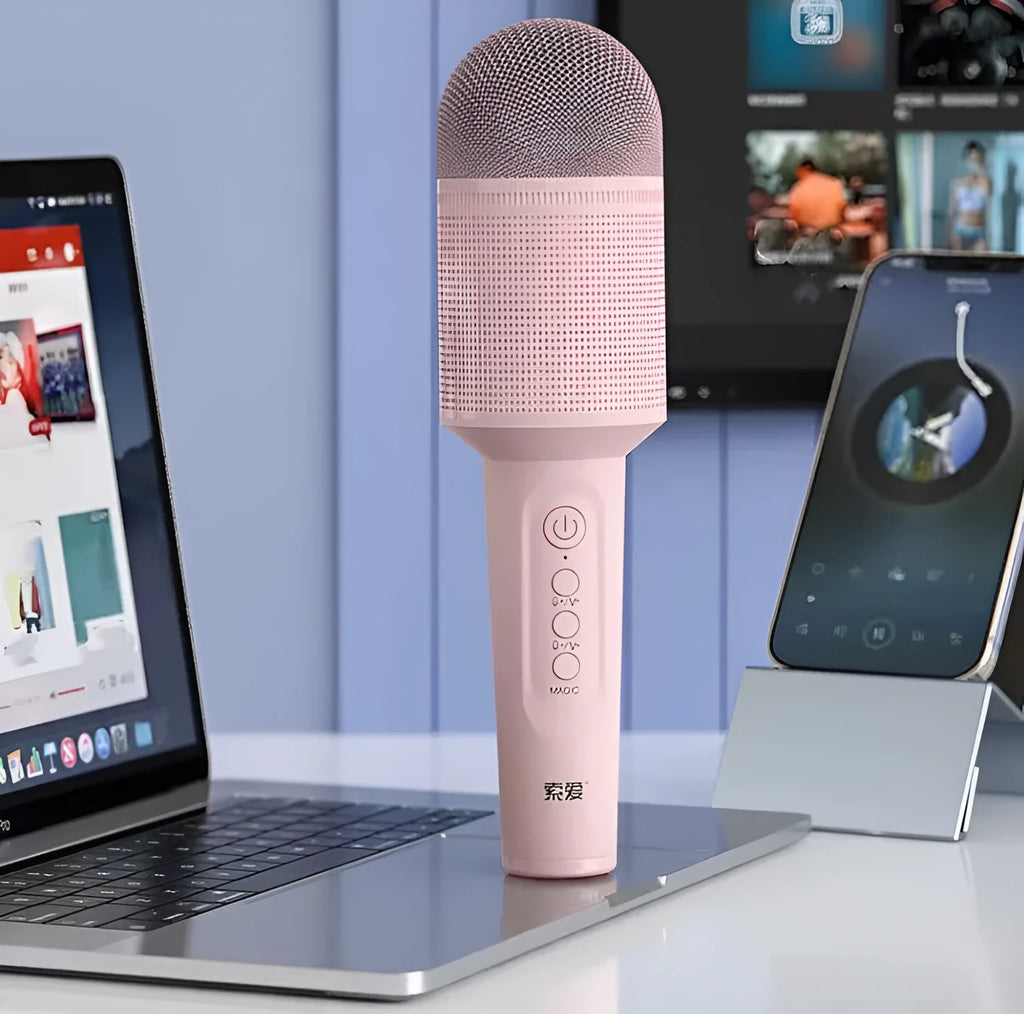 Girly pink wireless Bluetooth karaoke microphone with USB connectivity style.