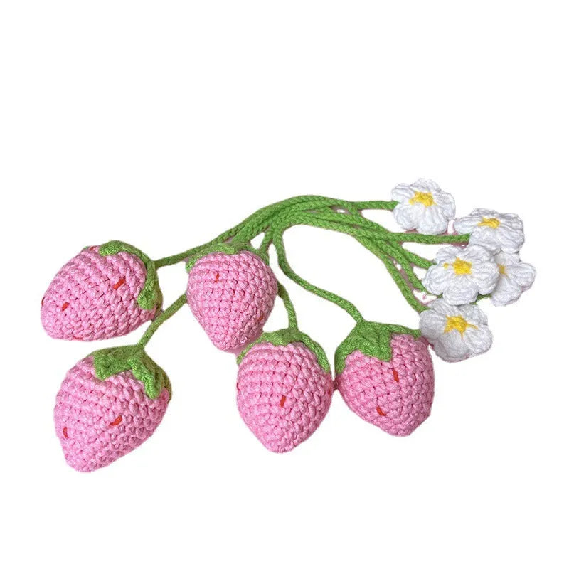Red knitted wool strawberry pendant on 35cm cord against neutral background