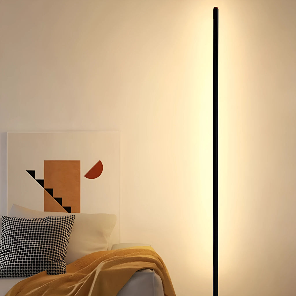Vertical aluminium floor lamp in modern simple style shown at different heights on a table.