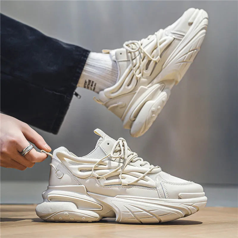 Men's beige and black sneakers with mesh upper, lace-up front, and rubber sole