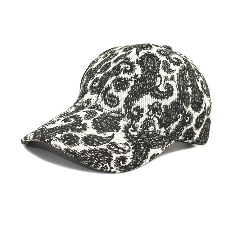 Blue polyester baseball cap with printed paisley pattern showing dome crown design