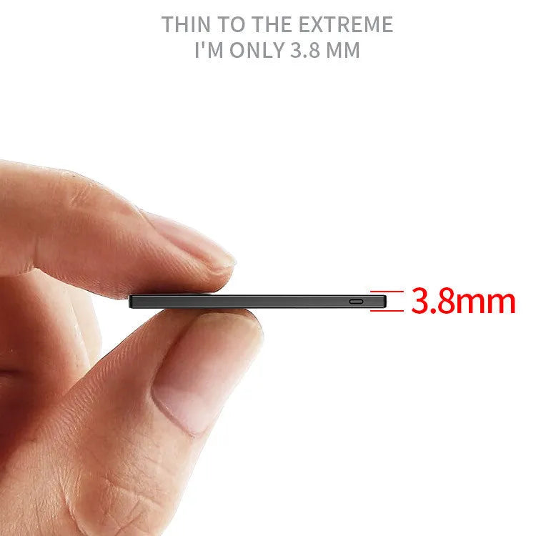 Ultra-thin black alloy card type power bank with built-in charging cable 10000mAh placed on a desk