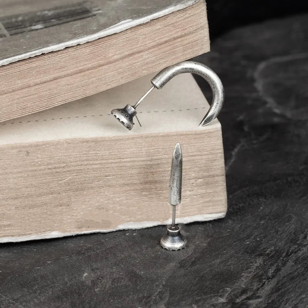 S925 sterling silver punk nail stud earring on ear hook, shown in straight and curved nail styles.