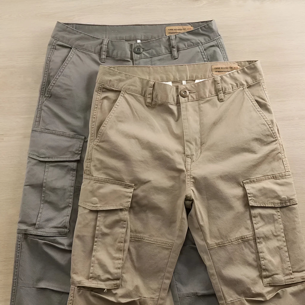 Men's solid colour cotton trousers with multiple pockets in a cropped length, shown in khaki, grey, black, and blue.