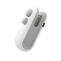 Blue handheld USB rechargeable heat sealer and bag cutter on a kitchen counter.