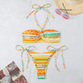 Women's halter bikini swimsuit with split briefs in polyester fabric showing colour options