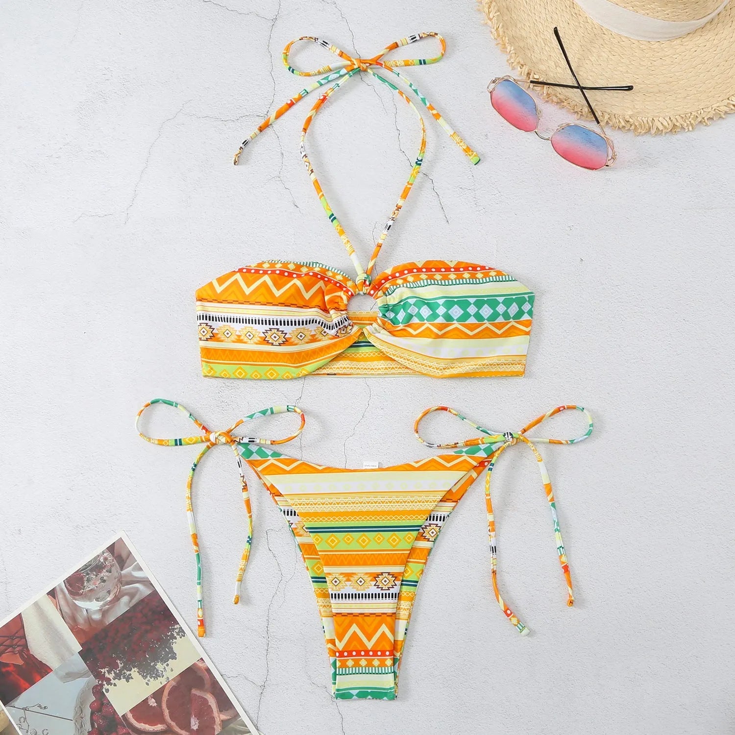 Women's halter bikini swimsuit with split briefs in polyester fabric showing colour options