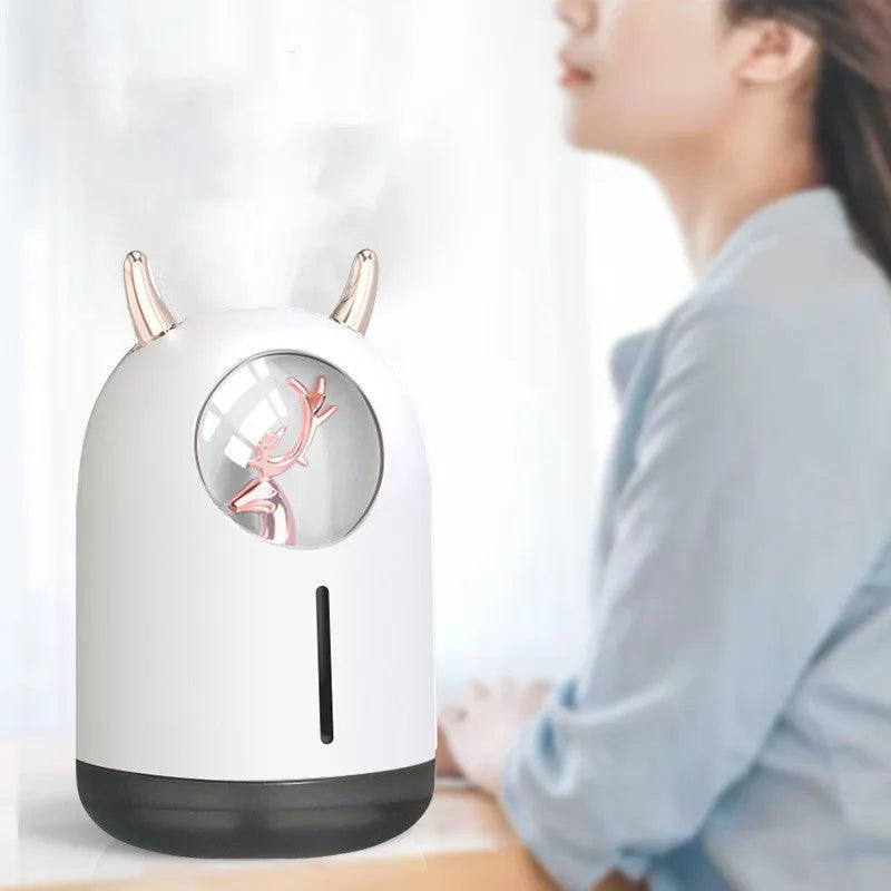 Mini animal-shaped USB aroma diffuser humidifier in white or pink with single mist outlet for small spaces