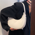 Retro dumpling-shaped women's shoulder bag in PU leather with a zippered pocket.