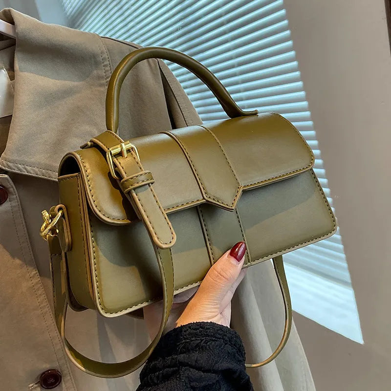 Women's beige PU messenger bag with sandwich pocket and file organiser interior.