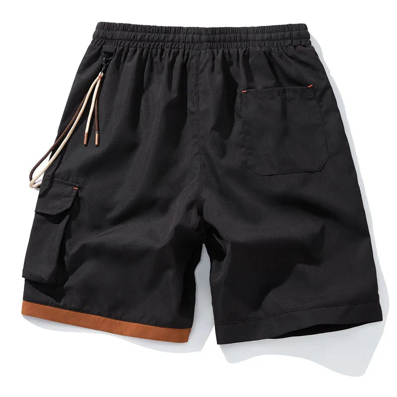 Man wearing coffee-coloured high-waisted bamboo fibre plus-size sports shorts with a loose, straight-leg fit.
