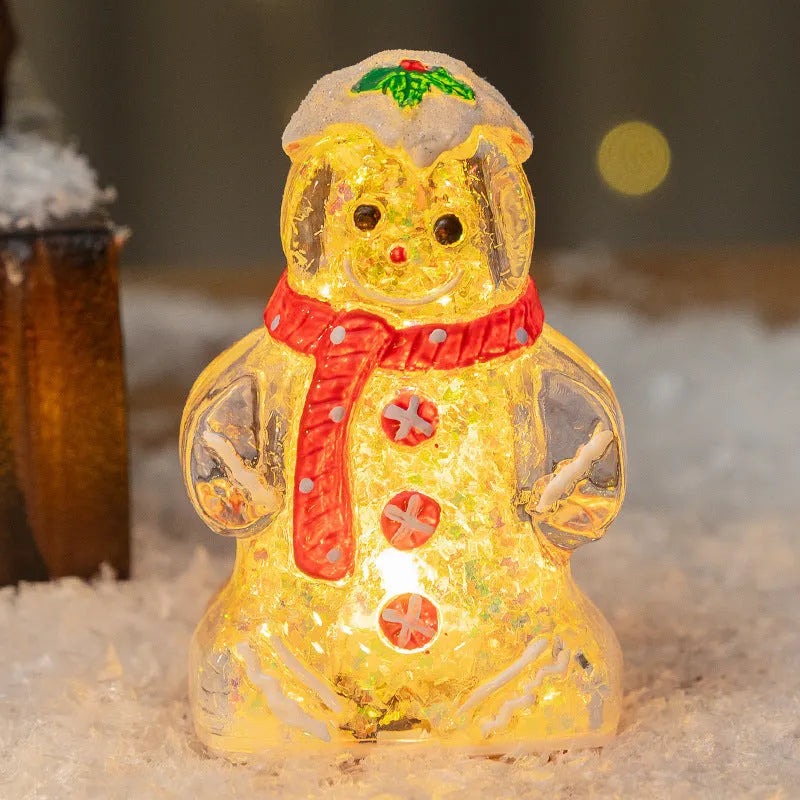 Glowing plastic gingerbread man Christmas ornament with red scarf, showing modern design and compact size.
