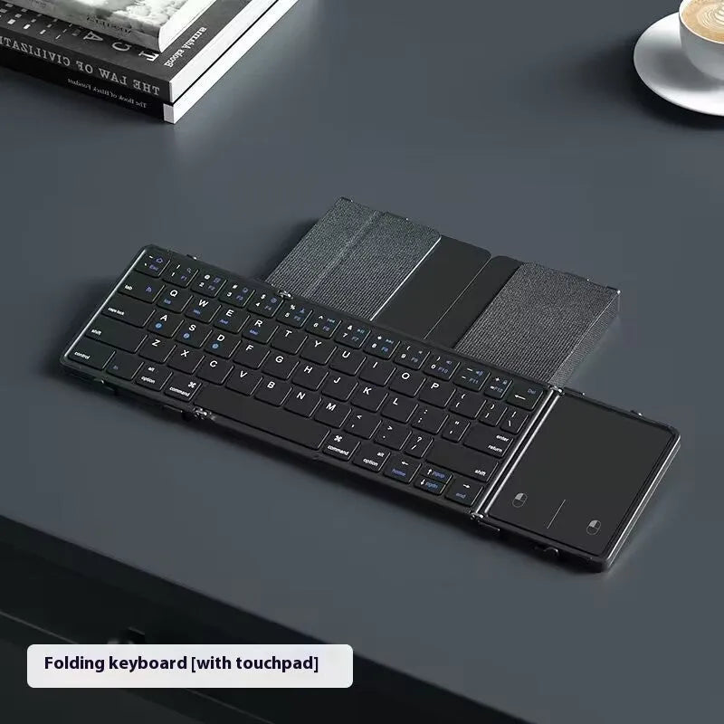 Black folding Bluetooth keyboard unfolded showing keys and touchpad option