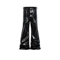 Black shiny patent leather coated skinny jeans on a denim background.