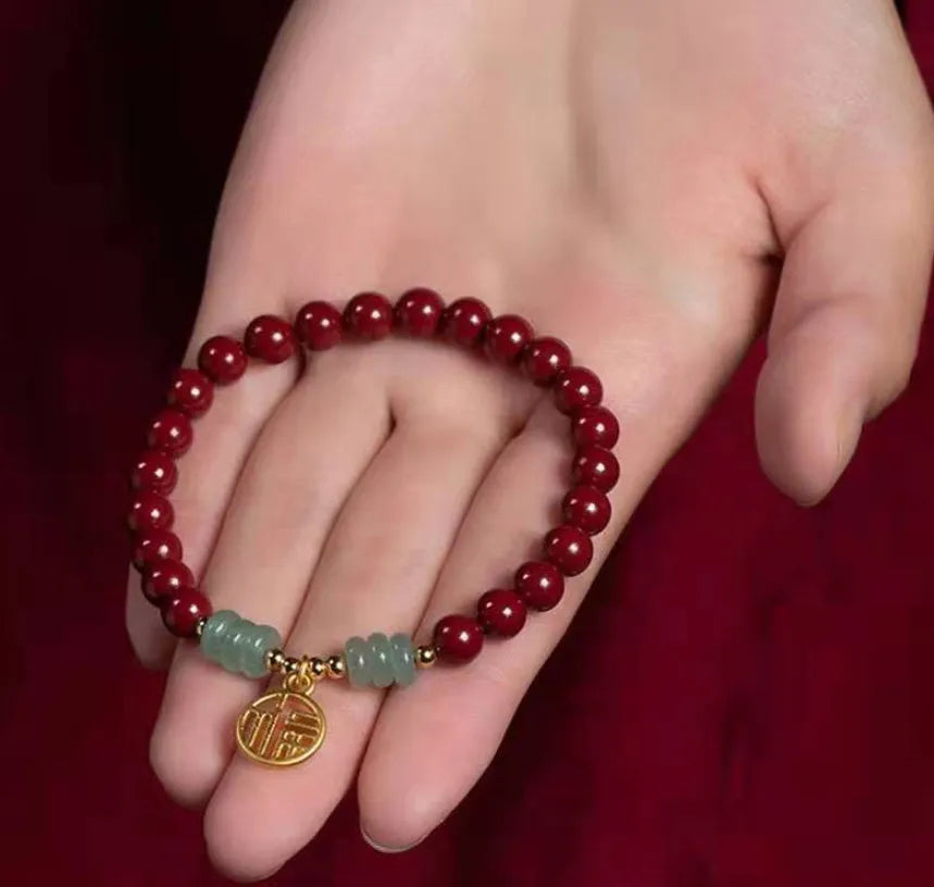 Handcrafted gold cinnabar bracelet with wave design in pumpkin cinnabar colour
