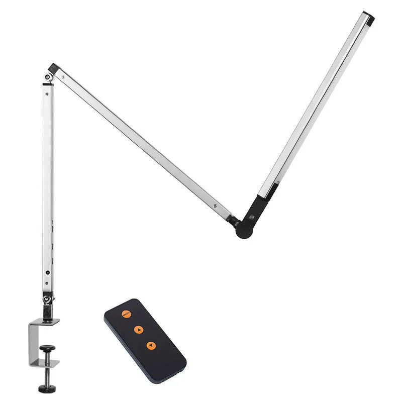 Black clip mount LED desk lamp with dimmer switch attached to study desk edge