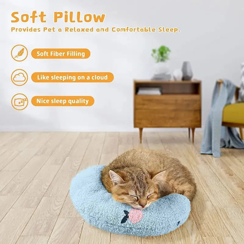 Plush white U-shaped pet pillow with raised rim for a cat or small dog to sleep curled up.
