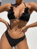 Black gathered style polyester swimwear set with a top and shorts on a mannequin