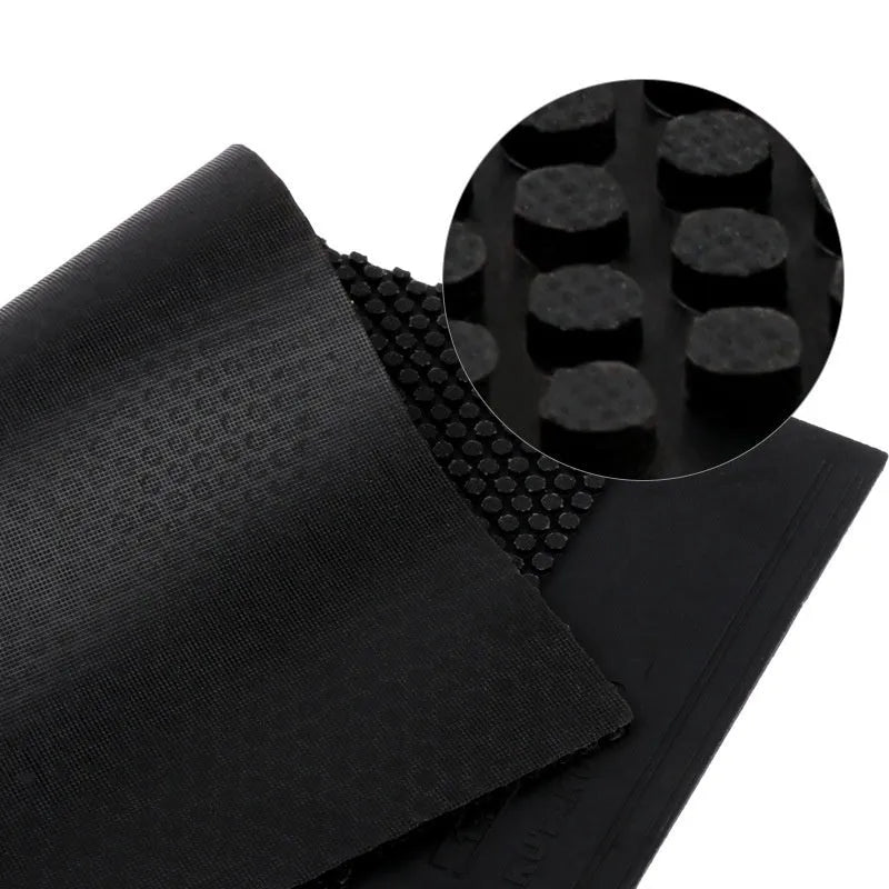 Single sheet of black table tennis rubber with small particle texture.