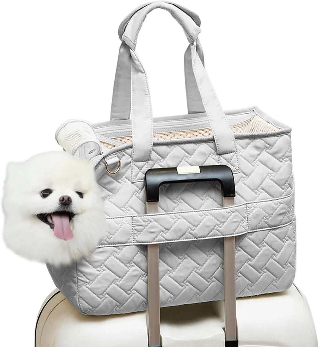 Grey pet carrier handbag with mesh panels showing interior cushion and safety cord attachment