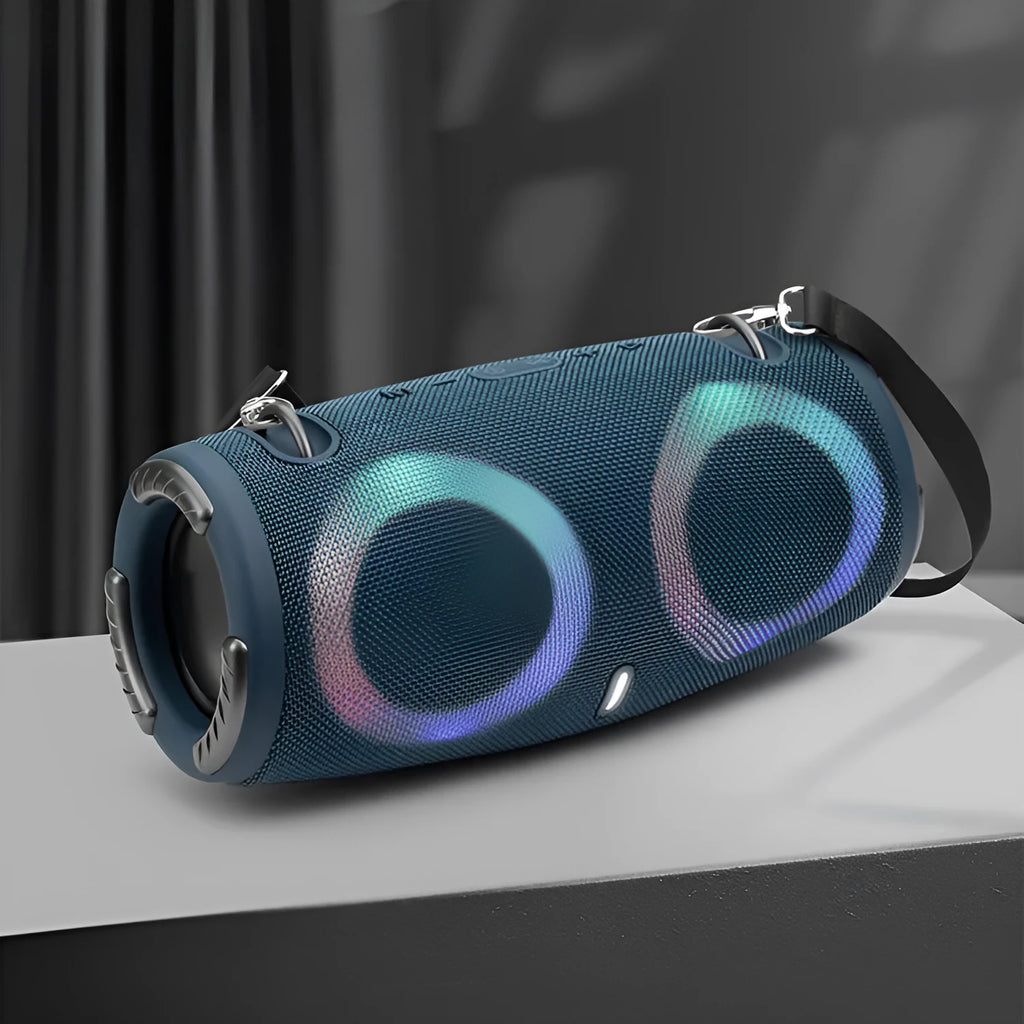 War Drum portable Bluetooth speaker with RGB coloured lights in black, showing built-in strap and control buttons.