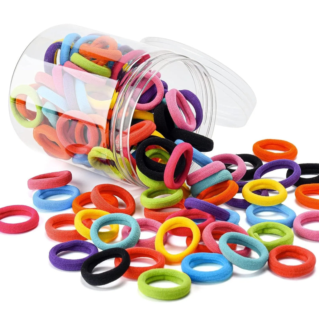 100 multicolour baby hair ties with seamless cotton construction in small storage jar