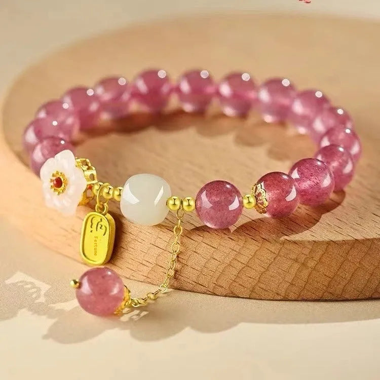 Handcrafted strawberry quartz crystal bracelet with Hetian jade peach blossom charms
