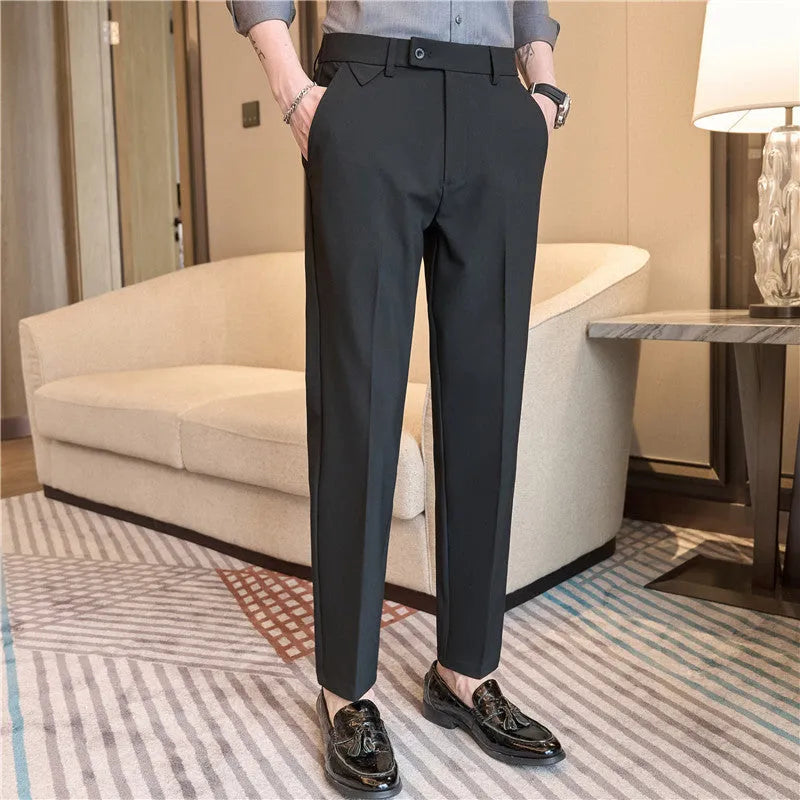 Men's brown suit trousers with waist stretch design, slim-fitting small straight cut, side view on hanger