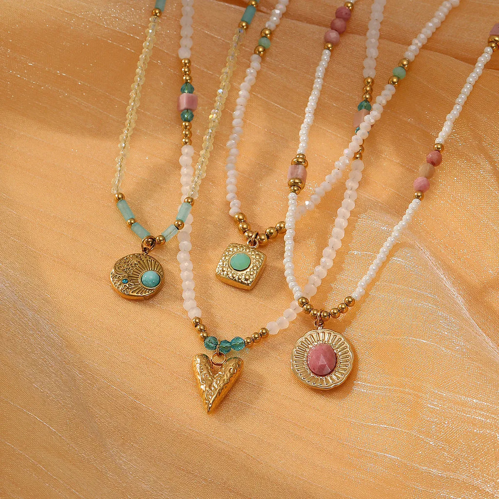Women's sunflower colour crystal bead necklace with rhodochrosite accents, stainless steel chain, and 18K gold-plated geometry pendant.