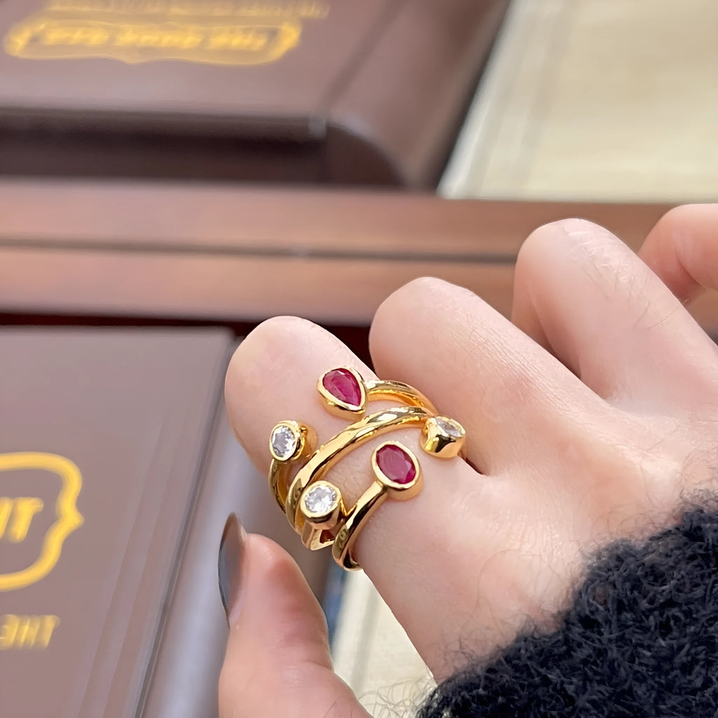 Irregular cross geometric ring with two-colour diamond detailing on copper with electroplated finish
