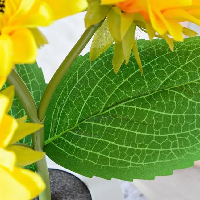 USB rechargeable artificial sunflower LED night light on table with decorative flower design