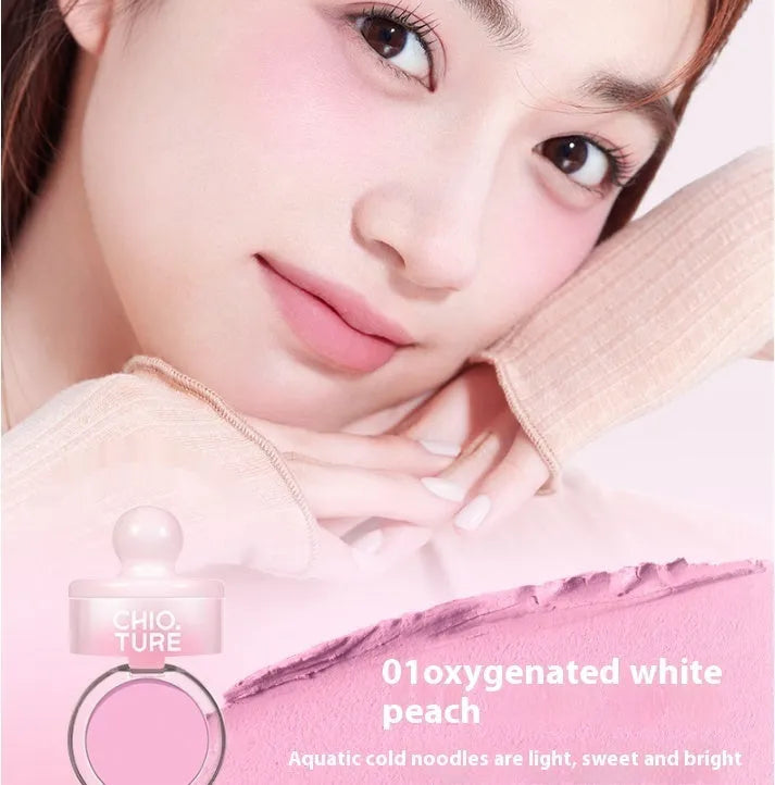 Can powder blusher mud compact in a nude shade with shimmer effect