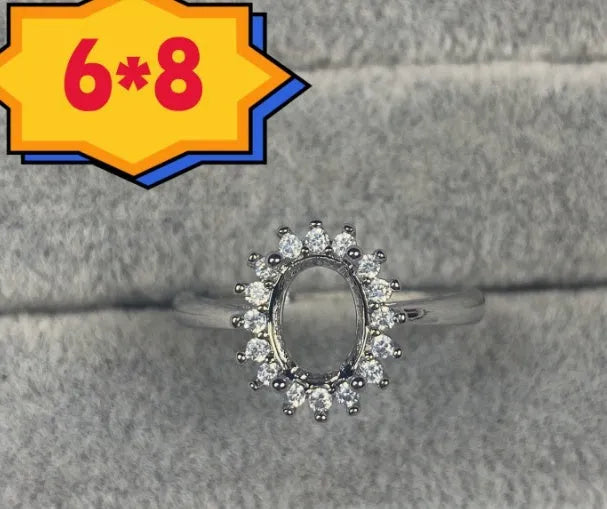 Oval open mouth copper ring with a 6*8 centre stone and five-pointed star ornament detail.