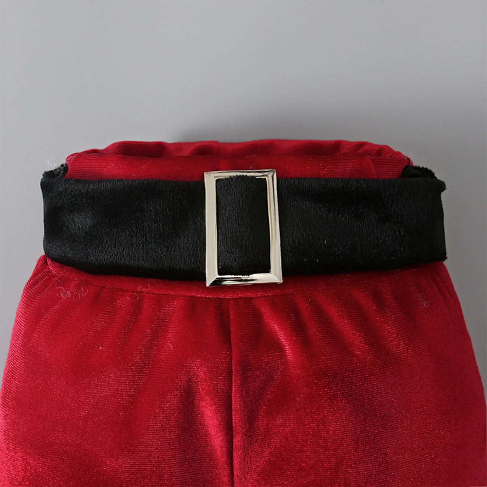 Red Korean velvet children's Christmas three-piece set with shirt, bell bottoms, and hat on display