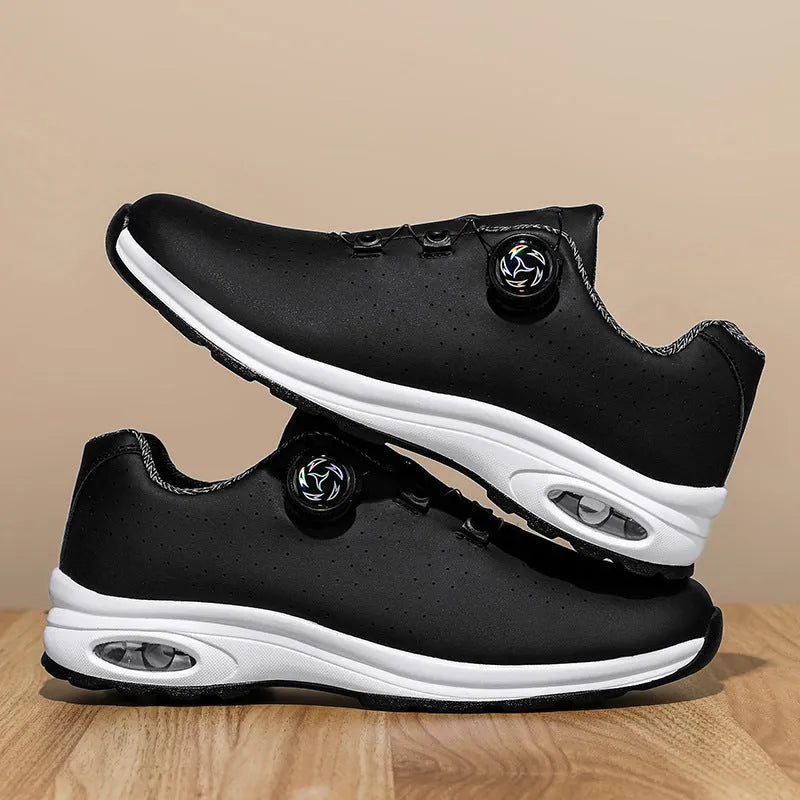 Black and white low-top mesh casual tennis shoes with cross shoulder straps and flat soles.